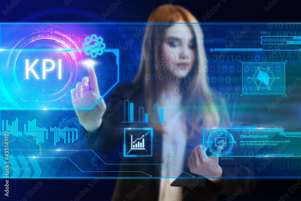 Business, Technology, Internet and network concept. Young businessman working on a virtual screen of the future and sees the inscription: KPI Business, Technology, Internet and network concept. Young businessman working on a virtual screen of the future and sees the inscription: KPI