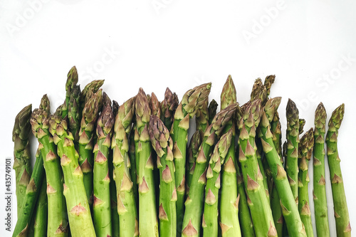 Green garden asparagus on the white background