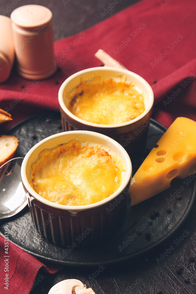 Ramekins with tasty julienne on dark background Ramekins with tasty julienne on dark background