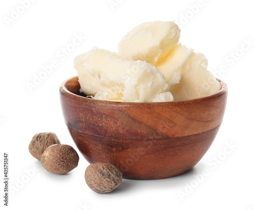 Fototapeta Naklejka Na Ścianę i Meble -  Bowl with shea butter and nuts on white background