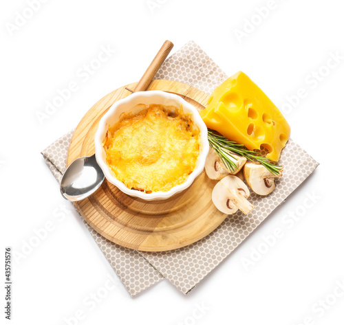 Ramekin with tasty julienne and ingredients on white background