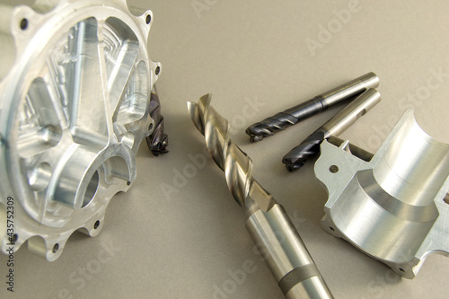 four cutters for metal processing. carbide tool. parts made with this tool lie next to each other