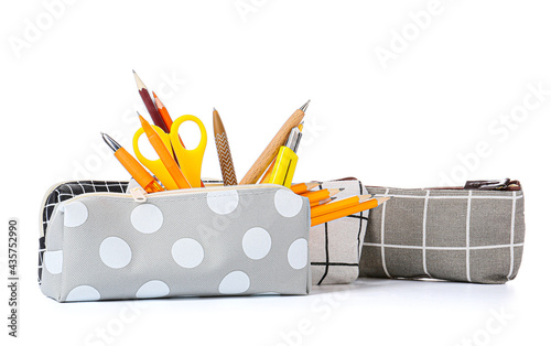 Canvastavla Pencil cases with stationery on white background