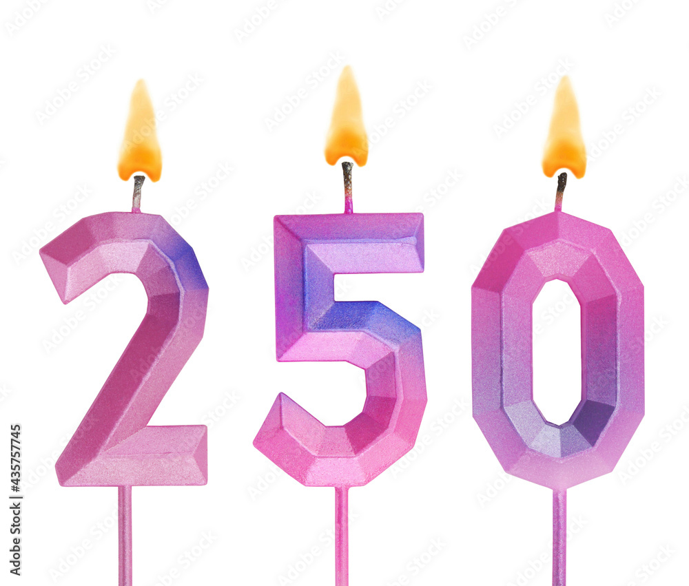 Pink and blue burning birthday candles isolated on white background, number 250 Pink and blue burning birthday candles isolated on white background, number 250