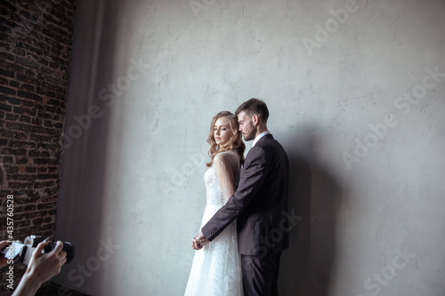 beautiful young couple. groom and bride. a modern wedding. dark interior