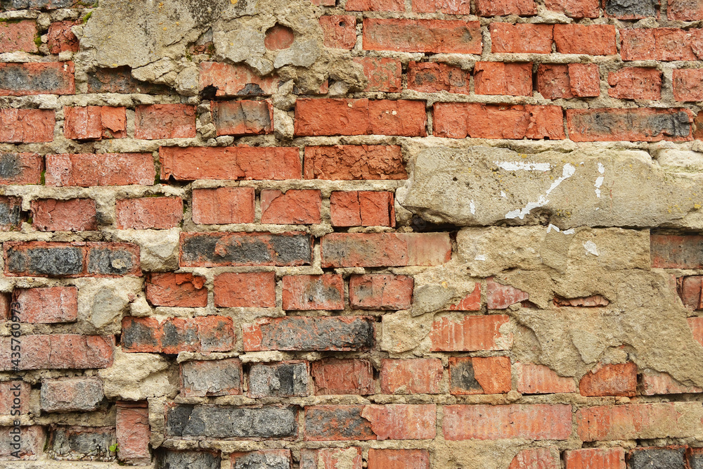 Naklejka premium Old weathered brick wall fragment .
