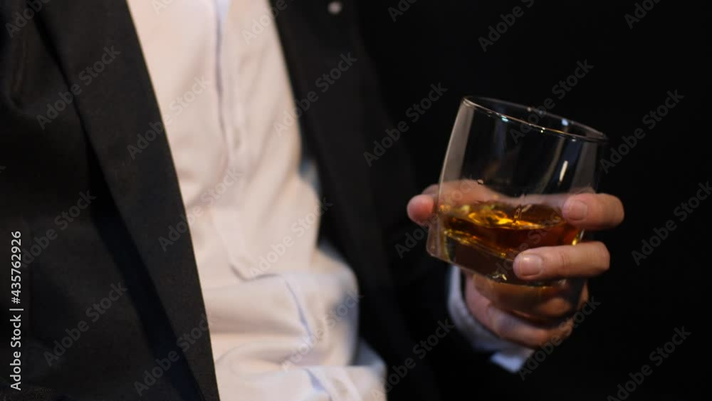 Business people sit whiskey holding whiskey a restaurant Business people sit whiskey holding whiskey a restaurant