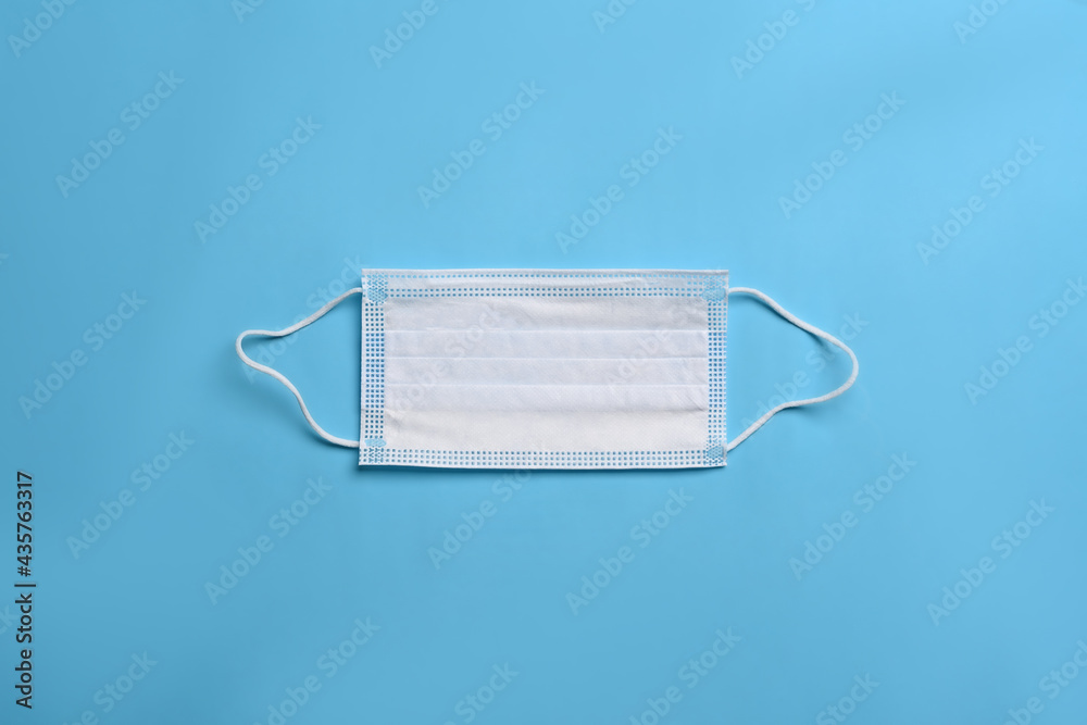 A protective mask on blue background. A protective mask on blue background.