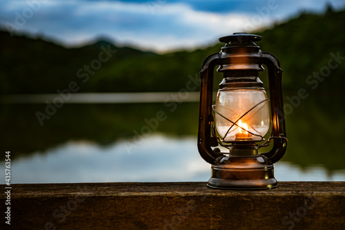 Light an oil lantern by the lake.
 photo