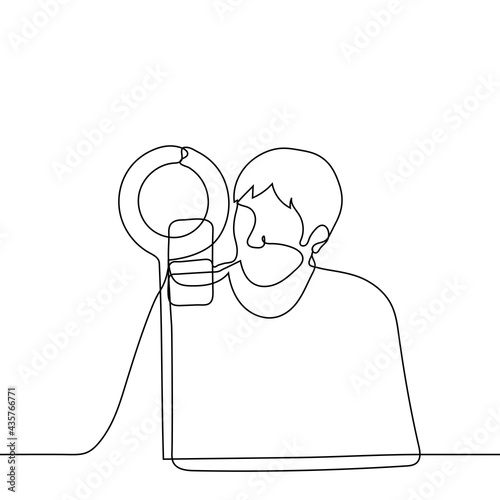 male blogger sitting in front of a ring lamp and a smartphone on a tripod - one line drawing. concept of live broadcast, stream. blogger or celebrity chatting with fans online, tutor leads the lesson