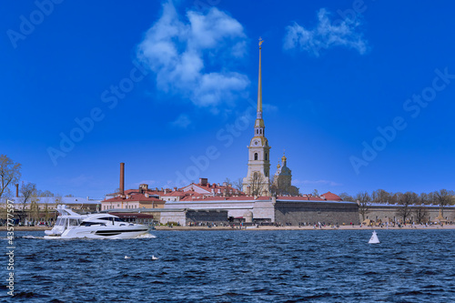 A white sea boat sails along the Neva River in St. Petersburg.