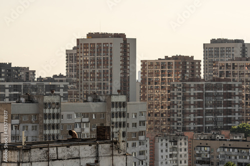 Cityscape of a stuffy city, densely built up with high-rise apartment buildings.