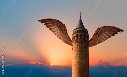 Galata tower with hawk wings at amazing sunset -  Istanbul Turkey