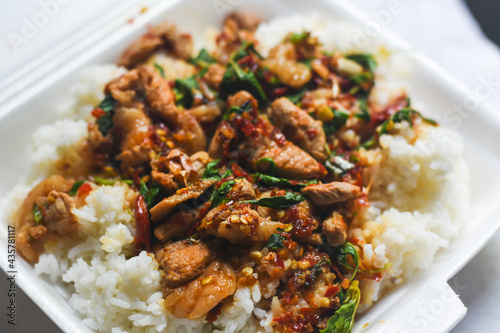 Rice topped with stir-fried pork and basil.