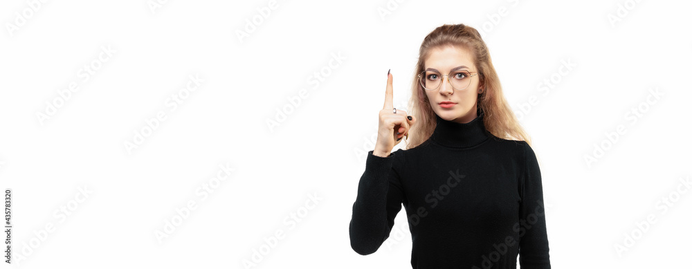 blonde girl feeling like a genius holding index finger proudly up in the air after realizing a great idea, saying eureka blonde girl feeling like a genius holding index finger proudly up in the air after realizing a great idea, saying eureka