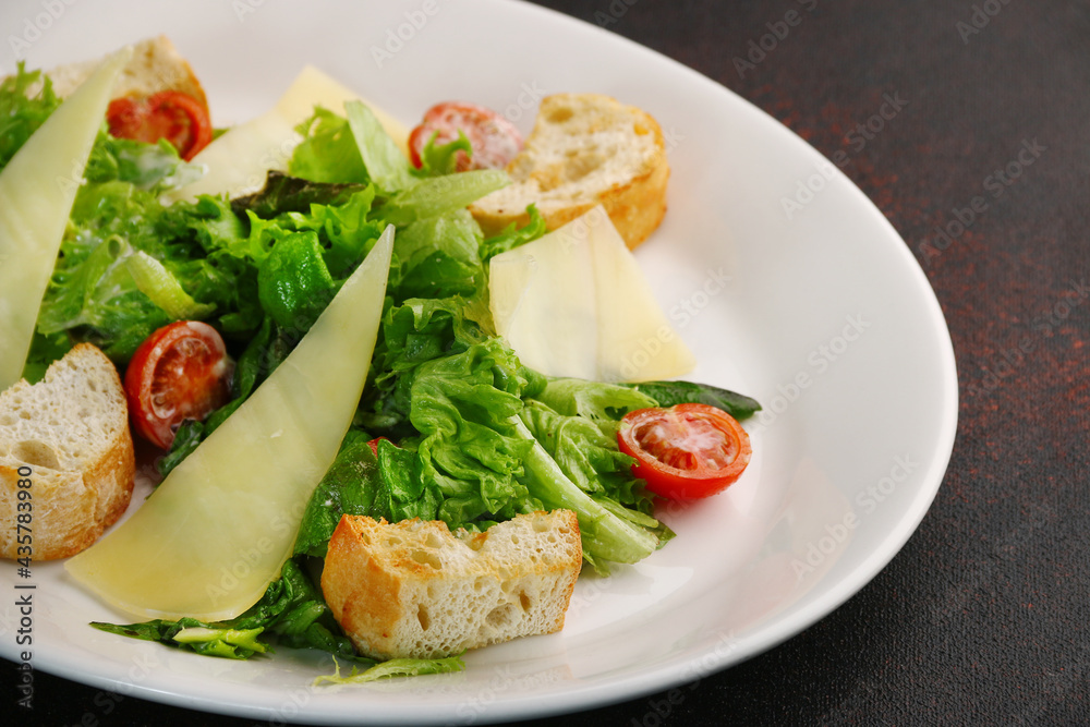 Caesar salad close up. chicken caesar salad with parmesan cheese