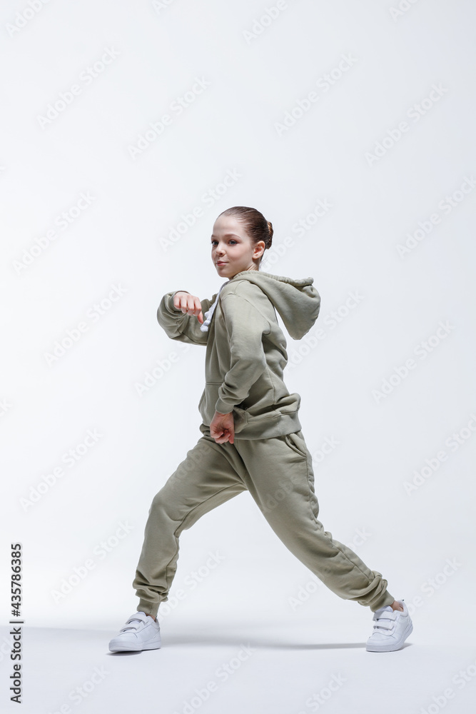 Young beautiful cool looking girl posing in studio Young beautiful cool looking girl posing in studio