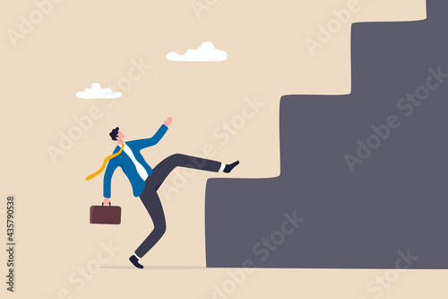 Business difficulty and challenge to overcome to achieve success goal, big step for career or adversity concept, businessman trying hard with full effort to climb up big step ladder or stairway.