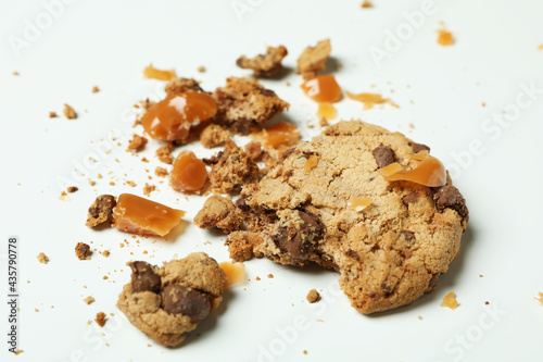 Tasty cookie with caramel on white background