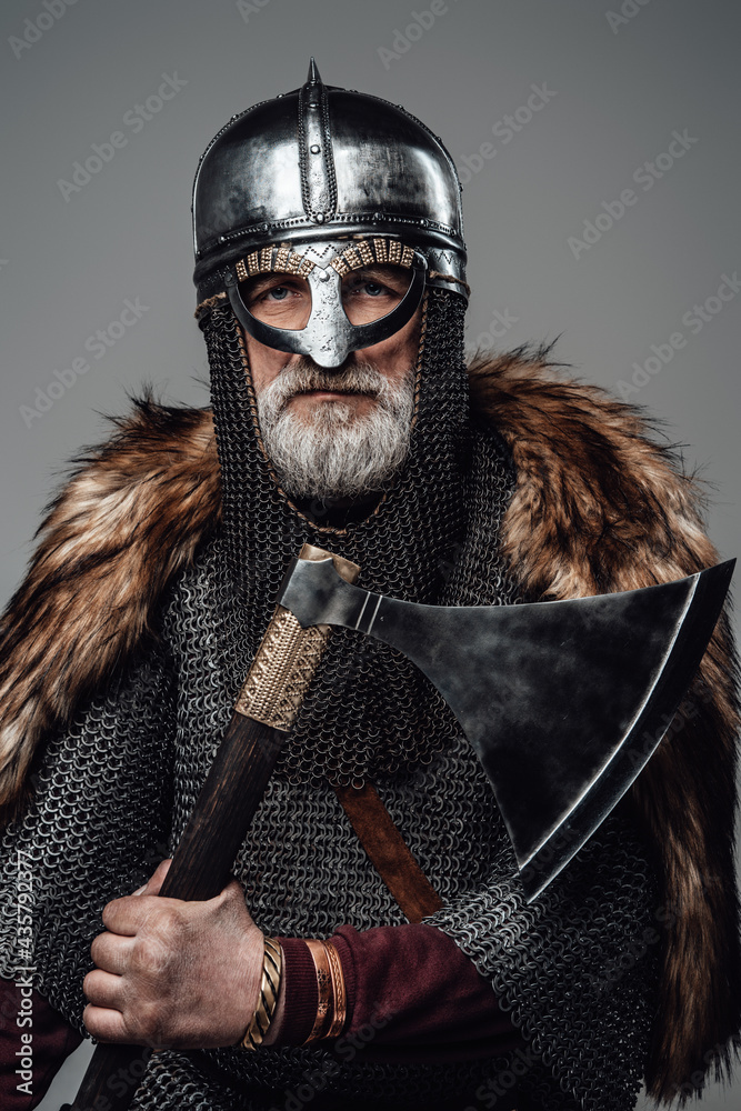 Old age scandinavian warrior with axe and mail
