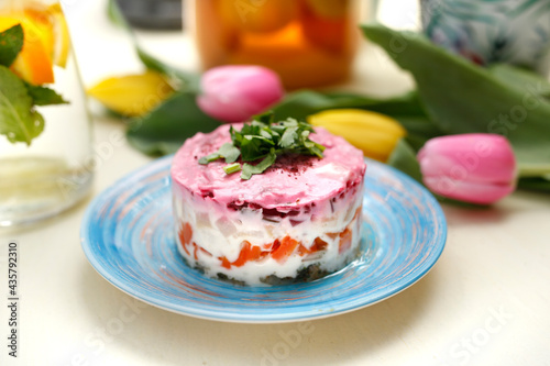 Herring salad with beetroots. Traditional dish.
A colorful appetizing dish. Culinary photography, food styling.