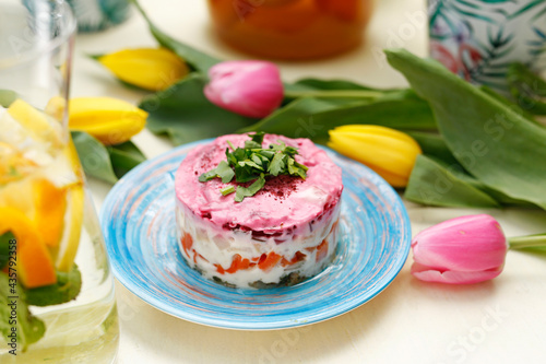 Herring salad with beetroots. Traditional dish.
A colorful appetizing dish. Culinary photography, food styling.