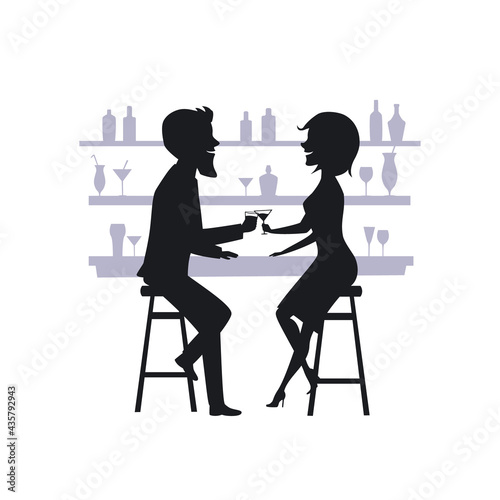 couple, man and woman on a date, drinking cocktails at the bar counter silhouette