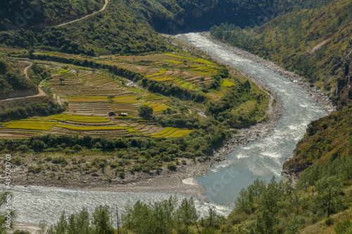 Landscape view with beautiful rice terraces in the Drangme Chhu river valley , near Trashigang, eastern Bhutan