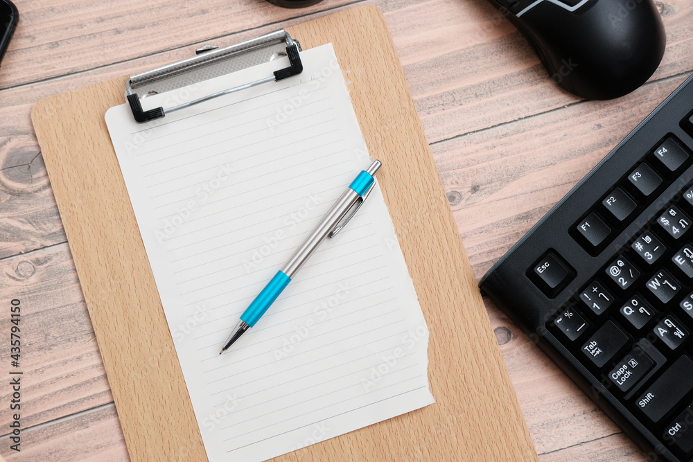 Keyboard on wood table background and top view working space
