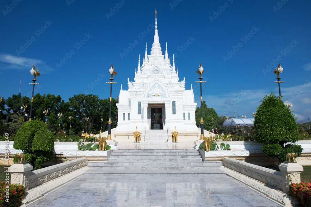 Suratthani Province,Thailand - APR 13,2021:White Suratthani City Pillar Shrine on blue background.Landmark of Suratthani Province.