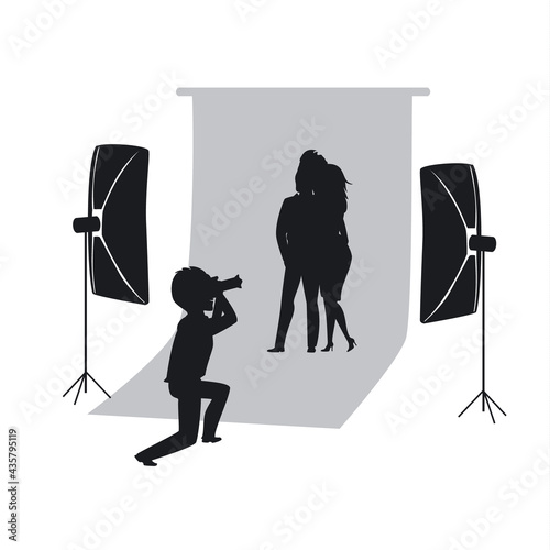 silhouette of couple making photo shoot in photo studio