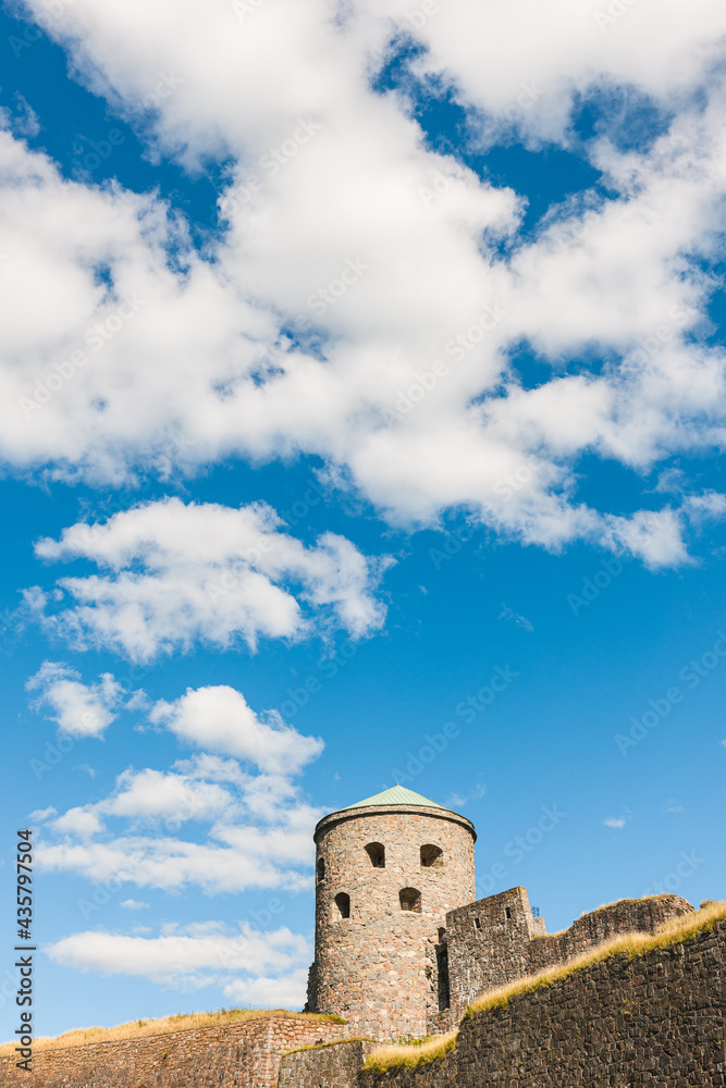 Old fortress tower against blue sky Old fortress tower against blue sky