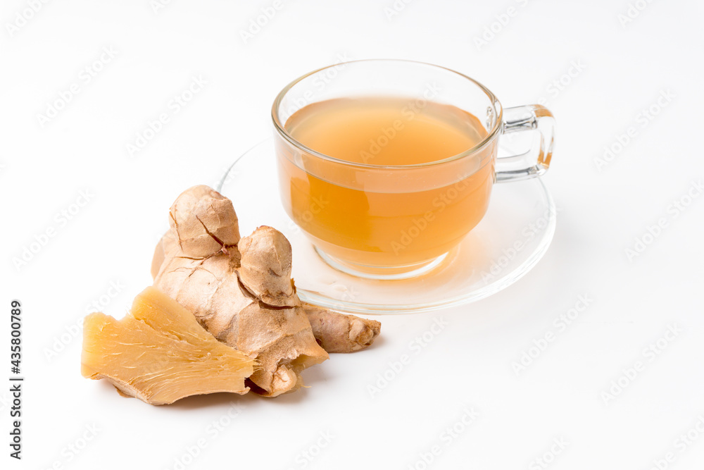 Ginger water and fresh ginger isolated on a white background. Ginger is a useful herb and has medicinal properties. Ginger water and fresh ginger isolated on a white background. Ginger is a useful herb and has medicinal properties.