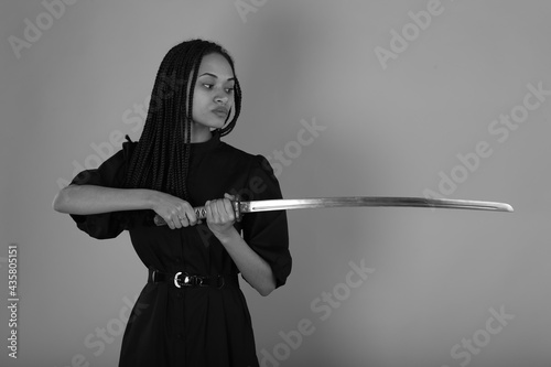 Young woman with sword in black and white