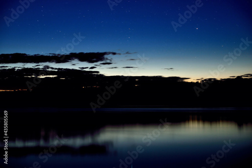 night river, night sky with stars, reflection in water © Александр Юркевич
