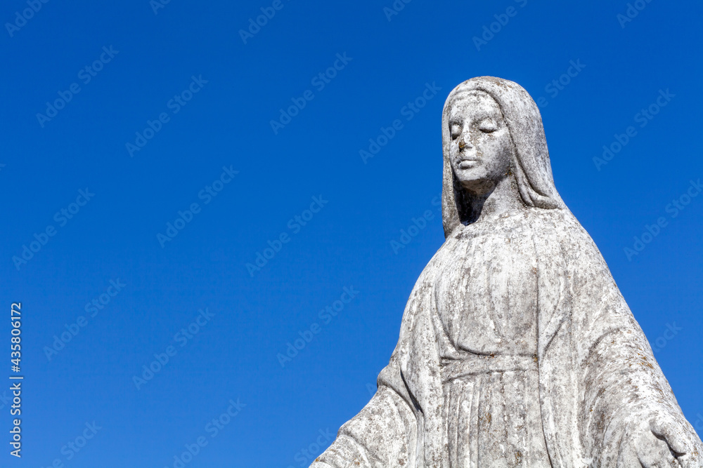 Mary, mother of Jesus, Mary of Nazareth old antique white stone statue background, copy space. Christianity symbols, catholicism, religion and faith abstract, catholic religious symbols banner