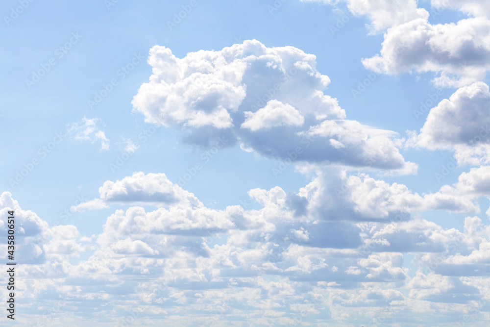 Fototapeta premium Simple soft cloudy blue sky background, many clouds, day time, sunlight, rough cloud texture, light blue white backdrop, nobody, clouds group nature wallpaper, bright abstract cloudscape, perspective