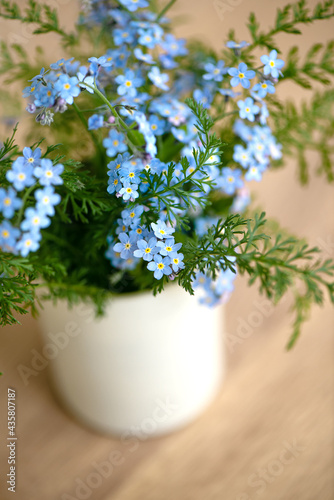 Close up of cute bouquet of forget-me-not blue flowers