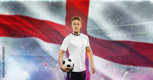 Fotografi England soccer player holding ball and looking at camera