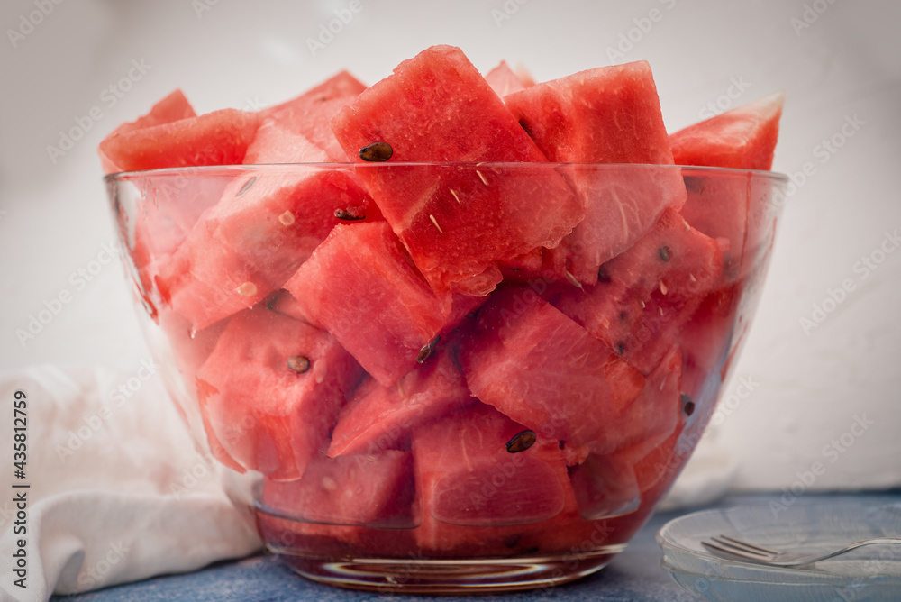 Fresh Watermelon Cut and served in a bowl on table during summer Fresh Watermelon Cut and served in a bowl on table during summer
