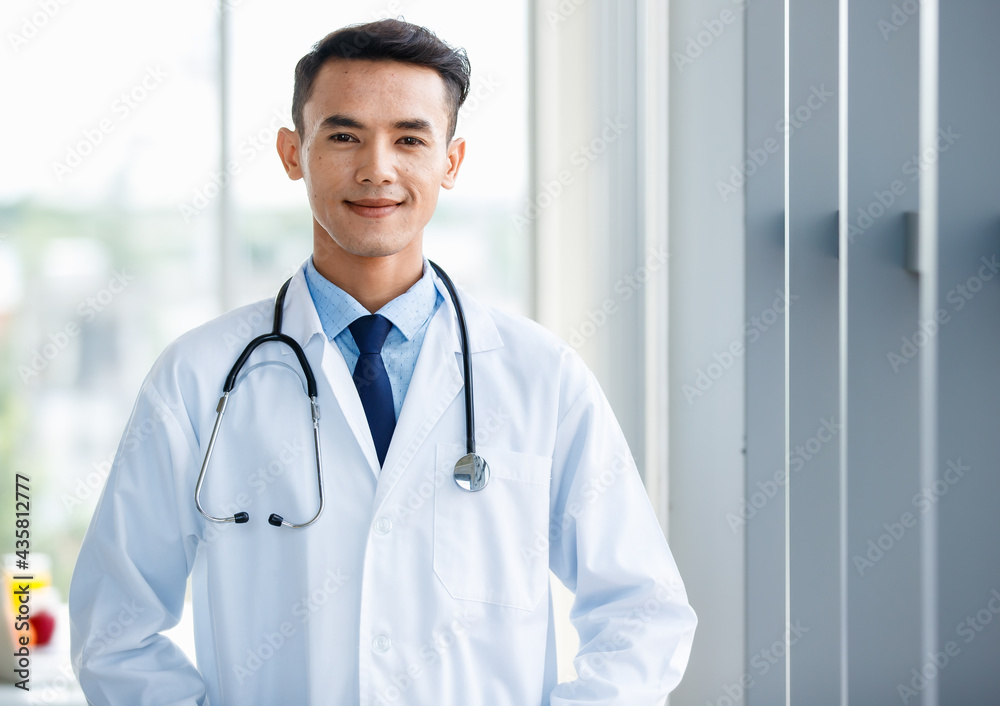Content male medic looking at camera in hospital Content male medic looking at camera in hospital