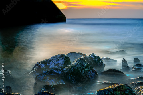 Long exposure of a romantic seascape with rocks