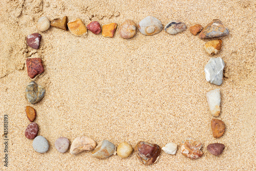 arranging stone on sand beaach for summer photo