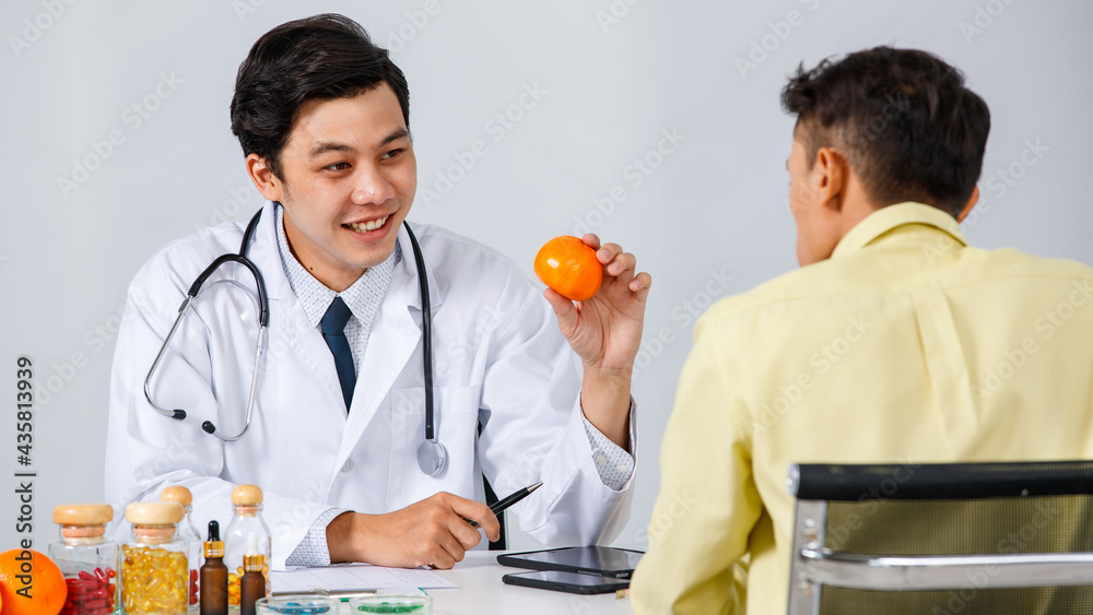 Smiling doctor talking to patient about healthy diet Smiling doctor talking to patient about healthy diet
