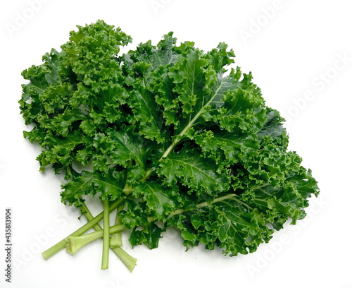 organic green kale leaves isolated on white background. photo