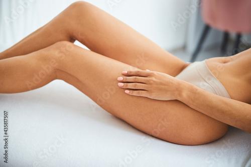 Beauty salon customer relaxing after a hair removal procedure