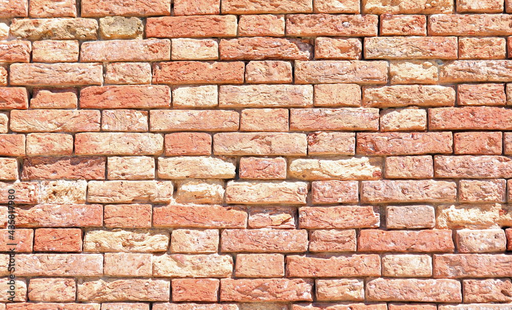 red old bricks of an ancient house made of terracotta red old bricks of an ancient house made of terracotta