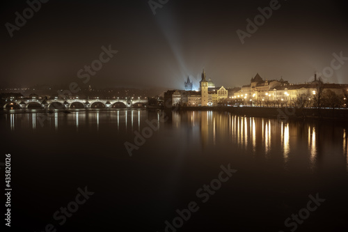 Night shot of Charles Bridge - Karluv most - over river Vltava in Prague; taken from Strelecky ostrov, long exposure photo