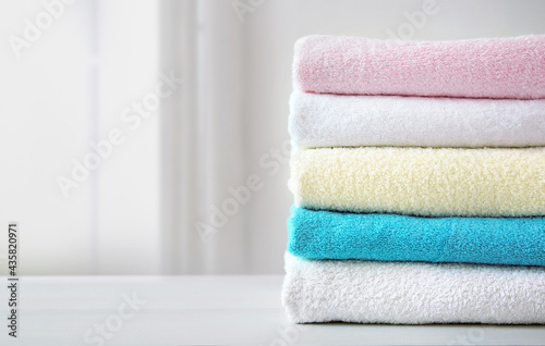Stack of colorful terry towels empty space design. Colorful laundry.Household.