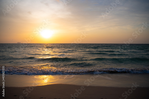 sunrise in ocean or sea at miami beach with silhouette of ship on sunset sky background, sunset. © be free